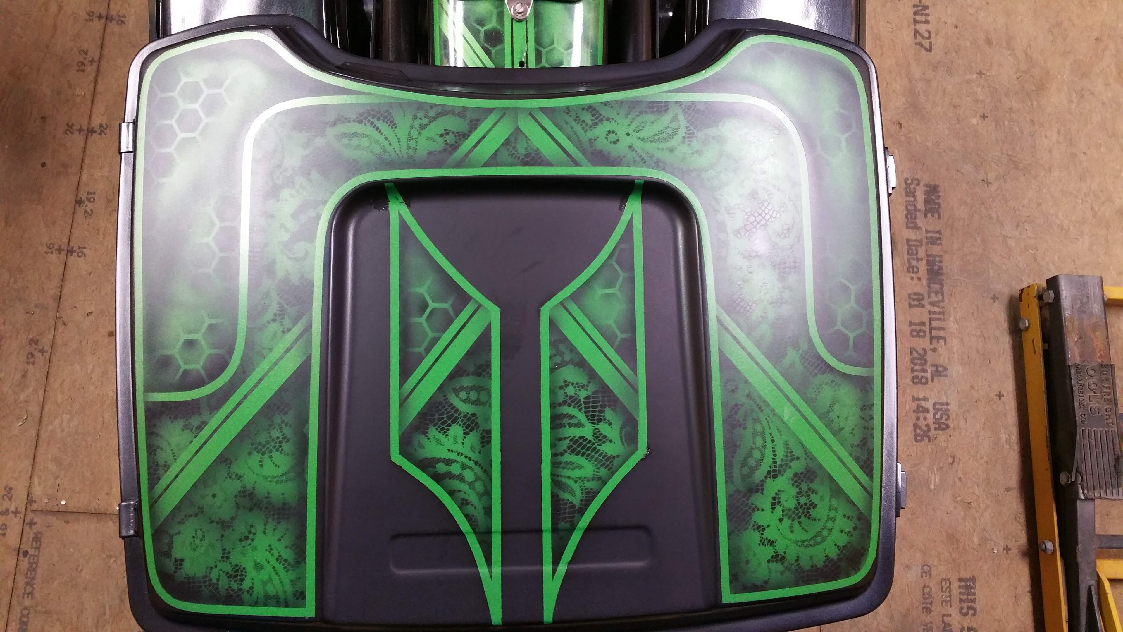Custom painted Harley bagger lid — green geometric and lace pattern